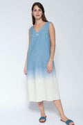 Woman wearing a blue and white gradient dress on a white background
