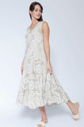Woman wearing a white floral dress on a white background