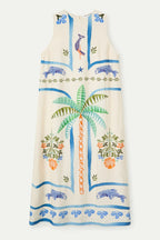 Beige dress with colorful palm tree and animal designs on a white background