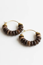 Pair of hoop earrings with wooden beads on a white background