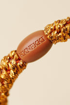 KKNEKKI Burned Terracotta Glitter Orange Hair Tie 9320, logo bead detail