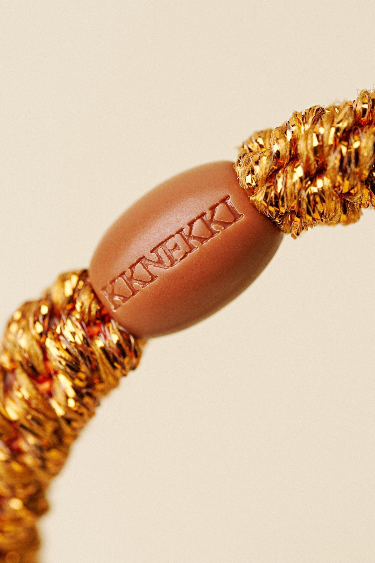 KKNEKKI Burned Terracotta Glitter Orange Hair Tie 9320, logo bead detail