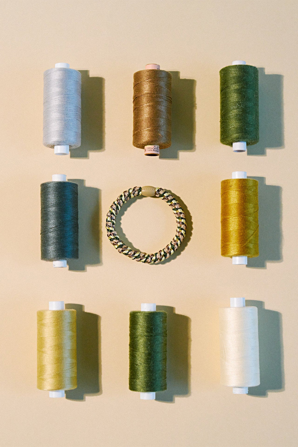 KKNEKKI Mix Army Yellow Multicolour Hair Tie 9312, styled with thread spools