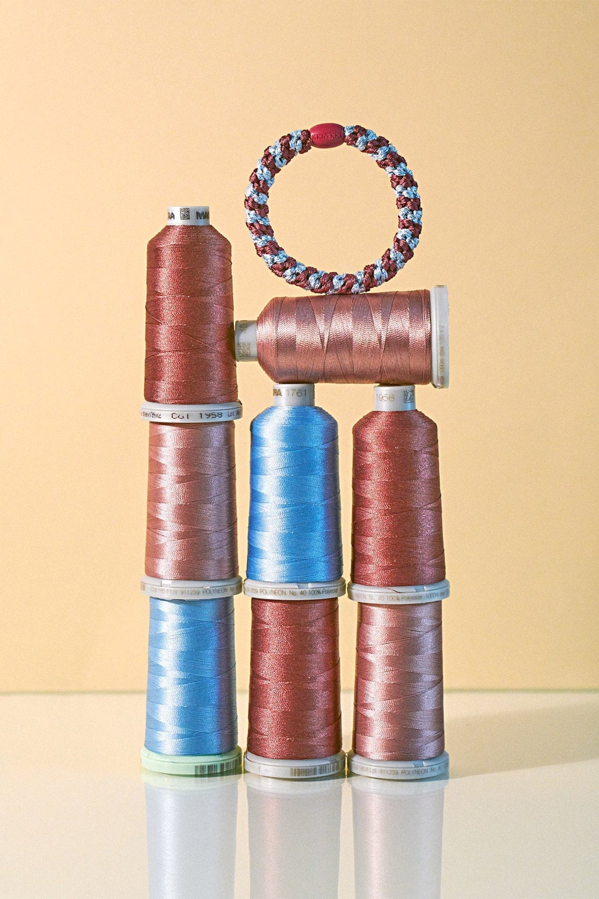 KKNEKKI Rosewood Seablue Glitter Stripe Multicolour Hair Tie 9318, styled with thread spools