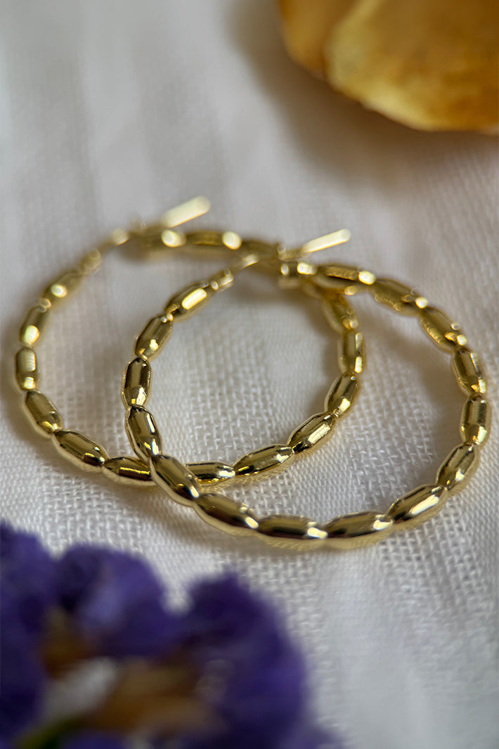 LBJ Jewellery Gold Plated Bobble Design Hoops E3061/3GP, close-up on linen