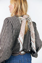 Lollys Laundry NoorLL Brown Print Fringed Scarf 70074-00046, worn across the shoulders from behind