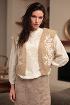 Luna Llena Leire Beige Sleeveless Jacket VE150, front view over a white blouse