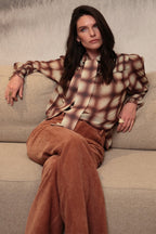 Luna Llena Maeve Coral Orange Flared Trousers TR312, seated view with a checked shirt