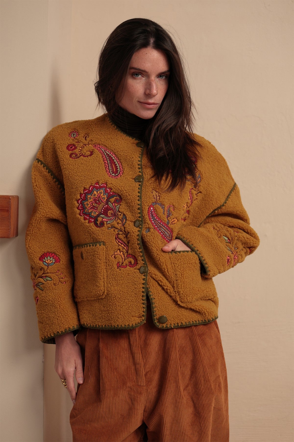 Luna Llena Nieves Mustard Yellow Jacket TD800, front view with hands in pockets