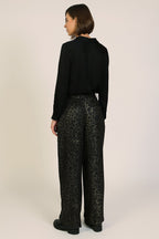 Traffic People Tallulah Black Leopard Print Wide Leg Trousers, back view on model