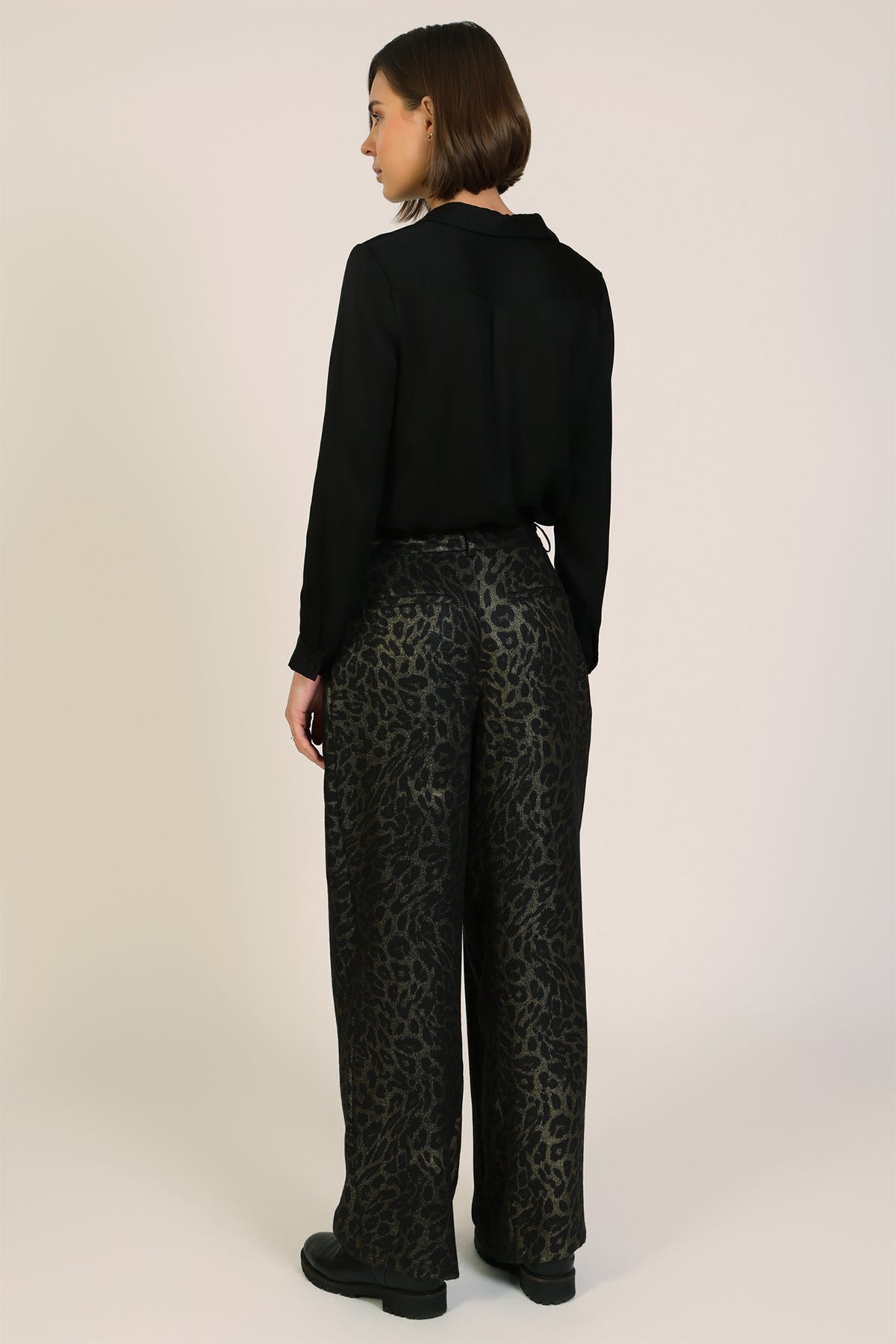 Traffic People Tallulah Black Leopard Print Wide Leg Trousers, back view on model