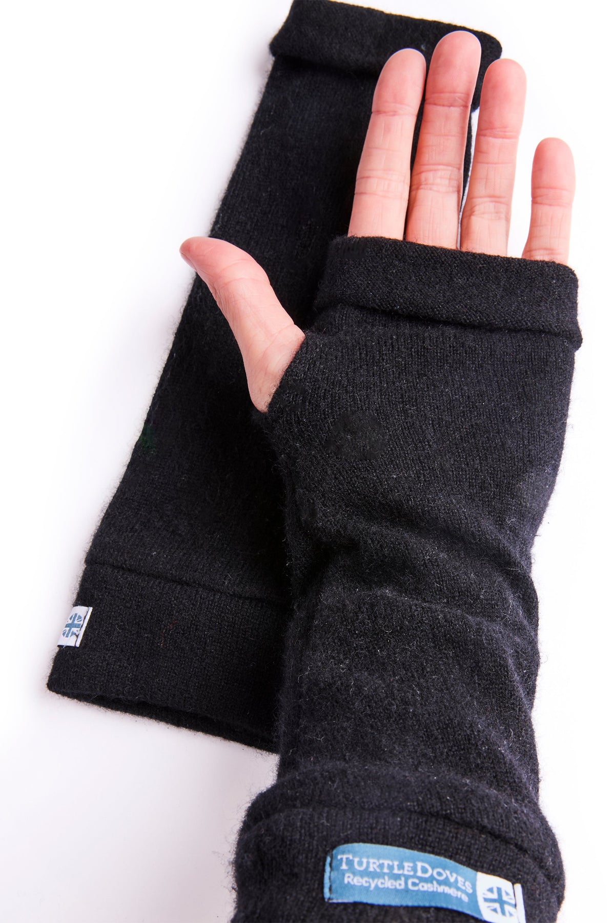 Turtle Doves Black Cashmere Fingerless Gloves, worn on hands, palm view