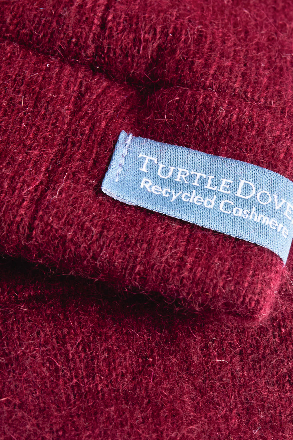 Turtle Doves Burgundy Red Cashmere Fingerless Gloves, cuff label close-up