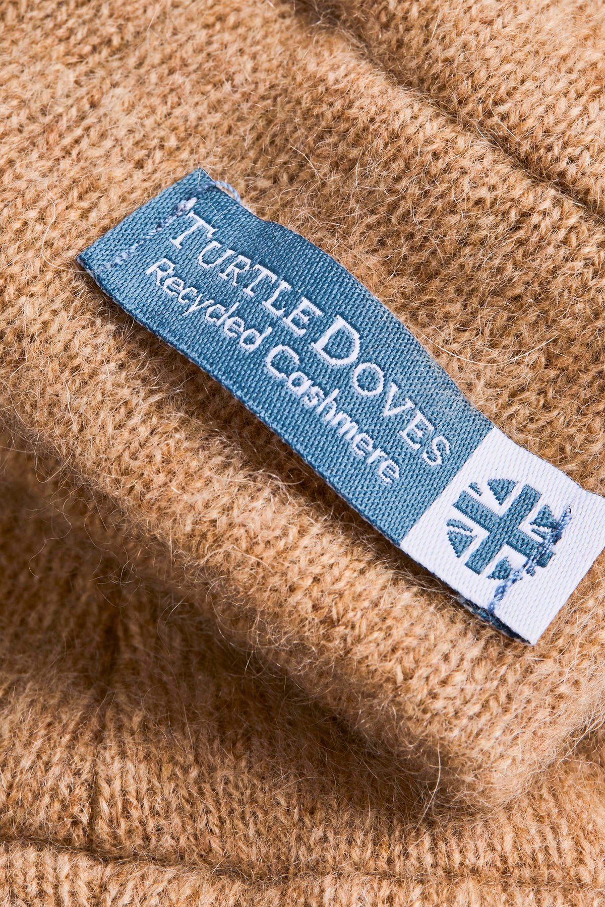 Turtle Doves Camel Brown Cashmere Fingerless Gloves, cuff label close-up