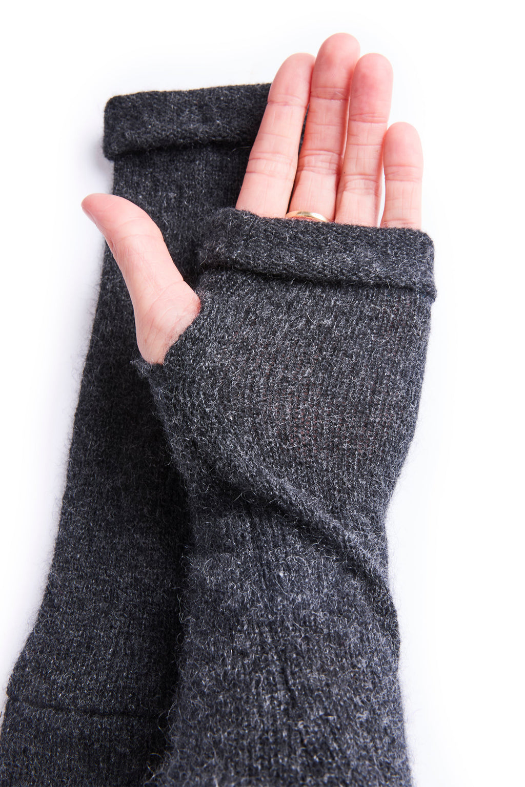 Turtle Doves Charcoal Grey Cashmere Fingerless Gloves, worn on hands, palm view