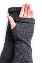Turtle Doves Charcoal Grey Cashmere Fingerless Gloves, worn on hands, palm view