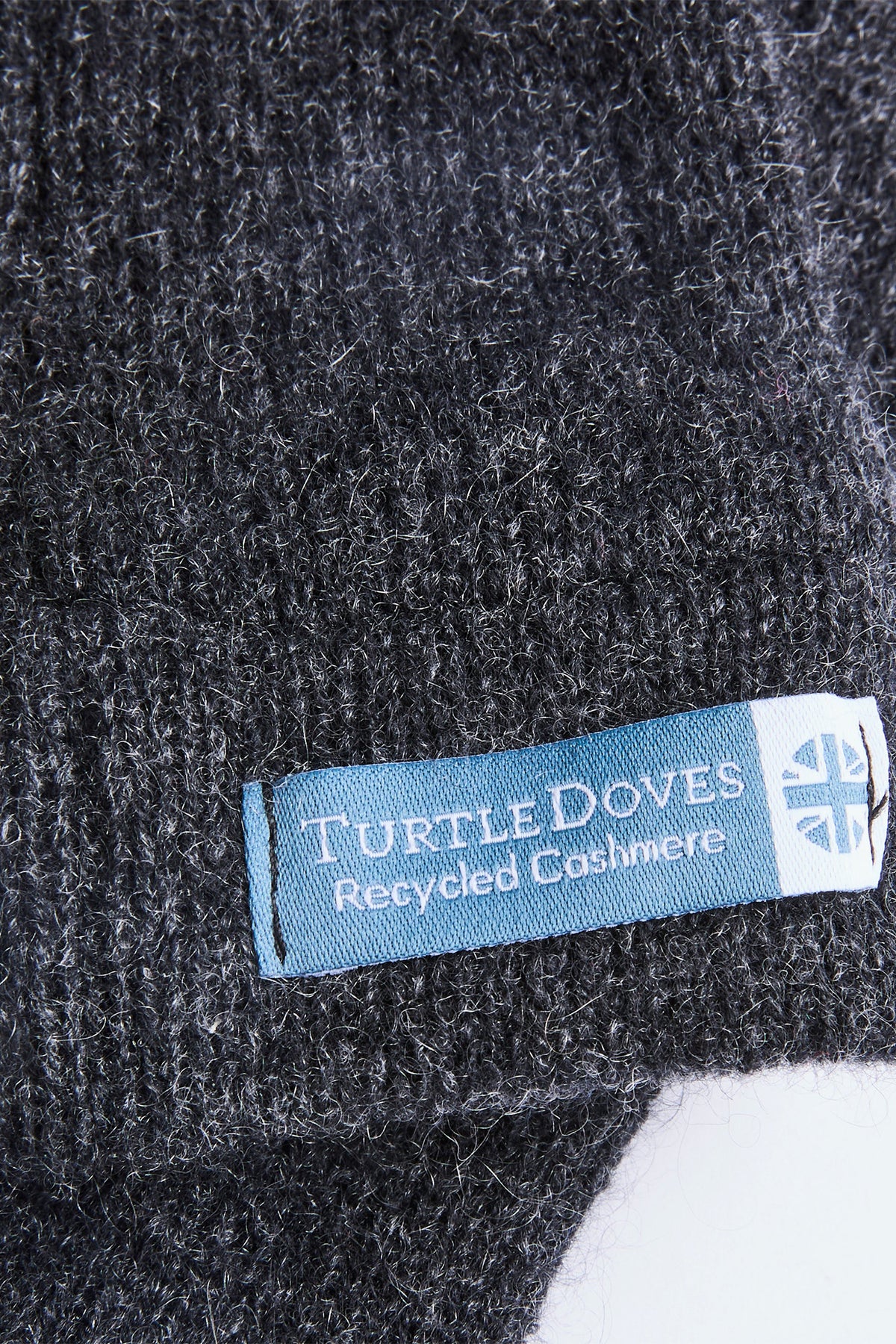 Turtle Doves Charcoal Grey Cashmere Fingerless Gloves, cuff label close-up