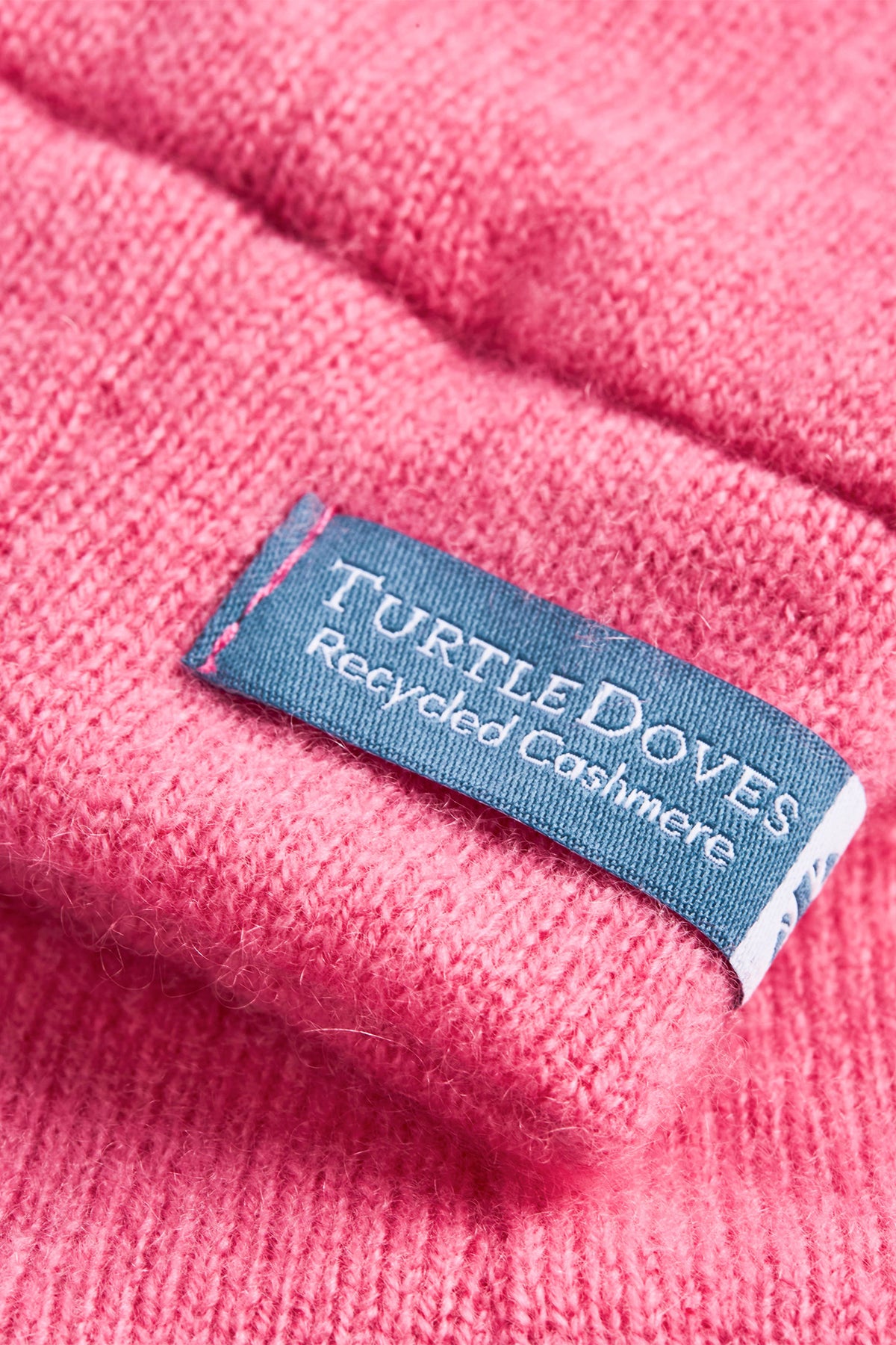 Turtle Doves Cherry Blossom Pink Cashmere Fingerless Gloves, cuff label close-up