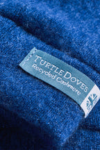 Turtle Doves Denim Blue Cashmere Fingerless Gloves, cuff label close-up