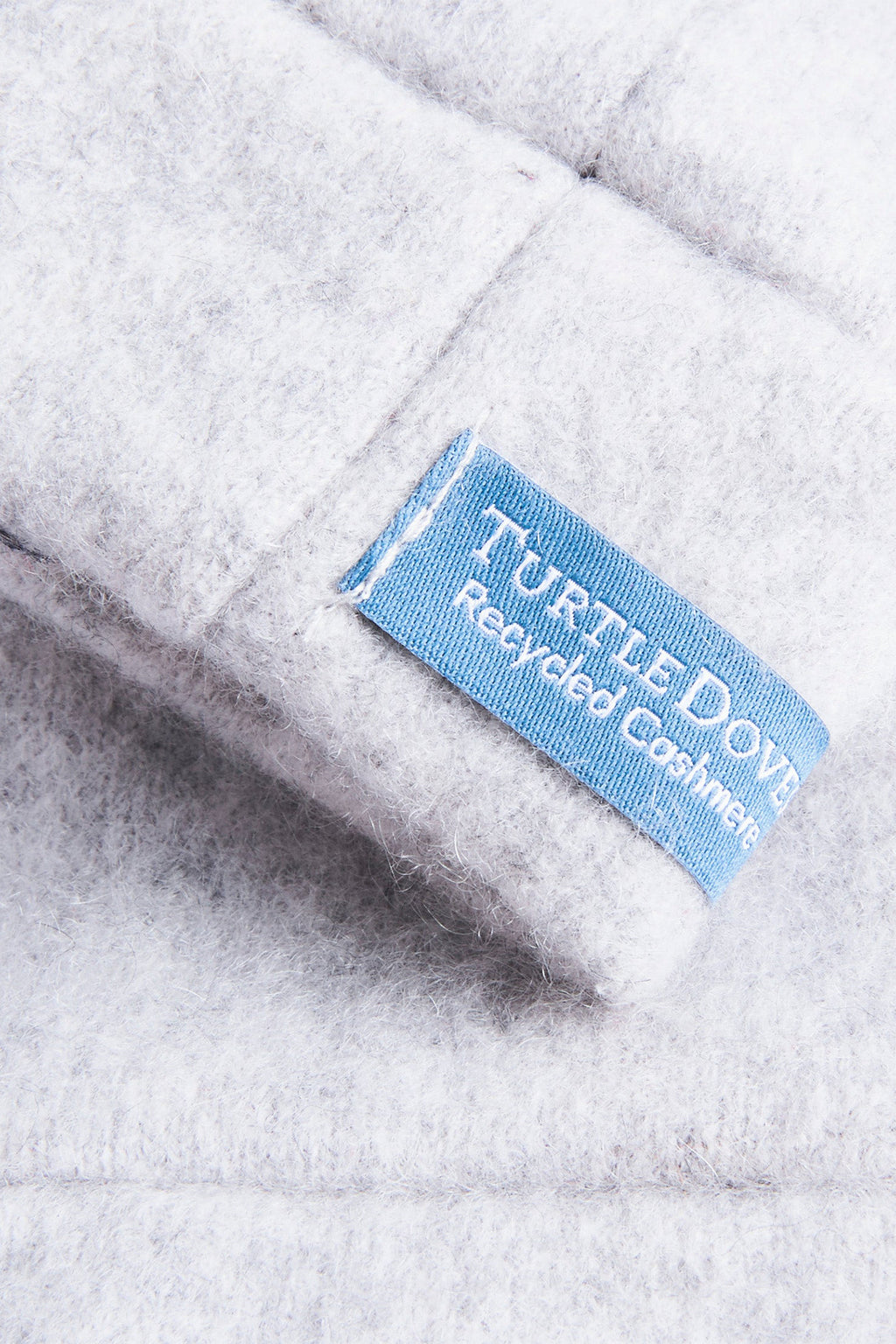 Turtle Doves Grey Cashmere Fingerless Gloves, cuff label close-up
