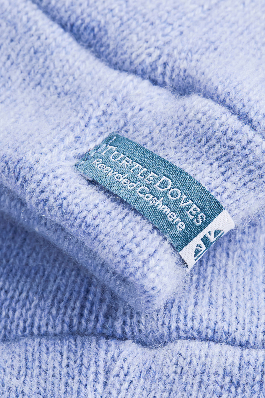 Turtle Doves Light Blue Cashmere Fingerless Gloves, cuff label close-up