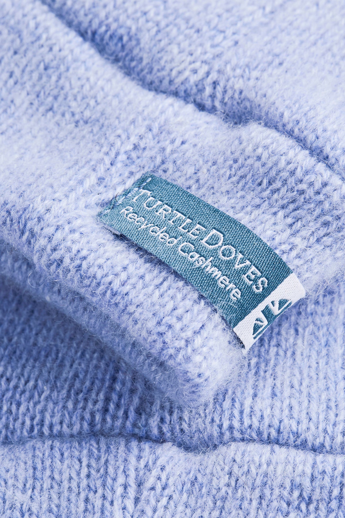 Turtle Doves Light Blue Cashmere Fingerless Gloves, cuff label close-up