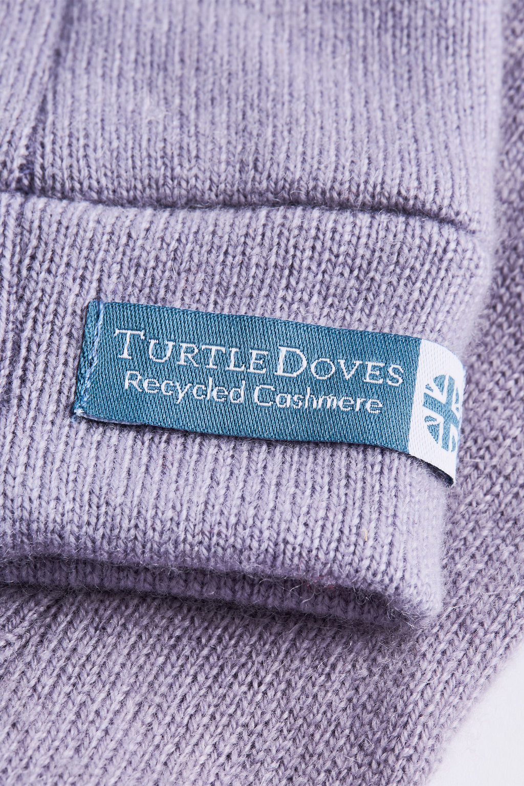 Turtle Doves Lilac Purple Cashmere Fingerless Gloves, cuff label close-up