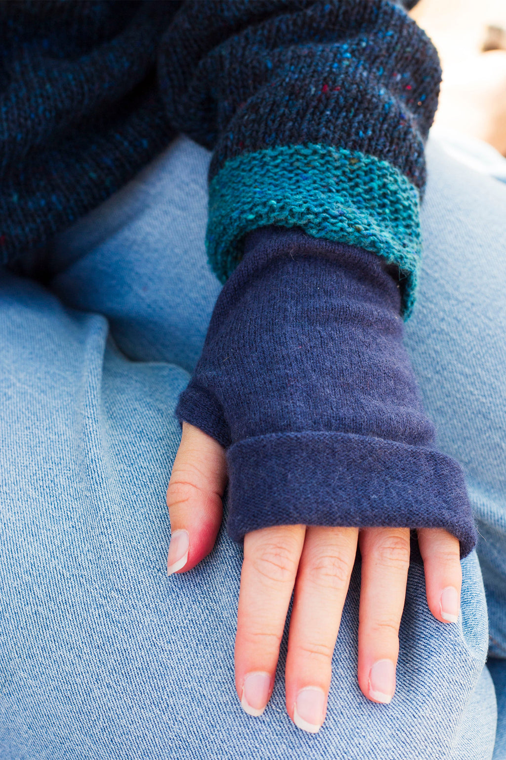 Turtle Doves Navy Cashmere Fingerless Gloves, worn with jeans, back of hand