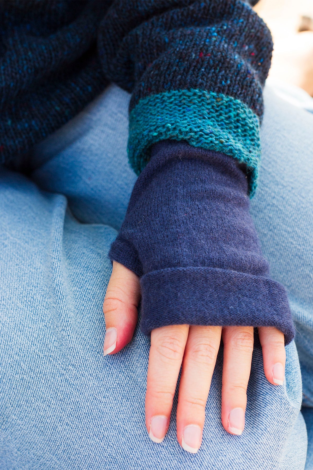 Turtle Doves Navy Cashmere Fingerless Gloves, worn with jeans, back of hand