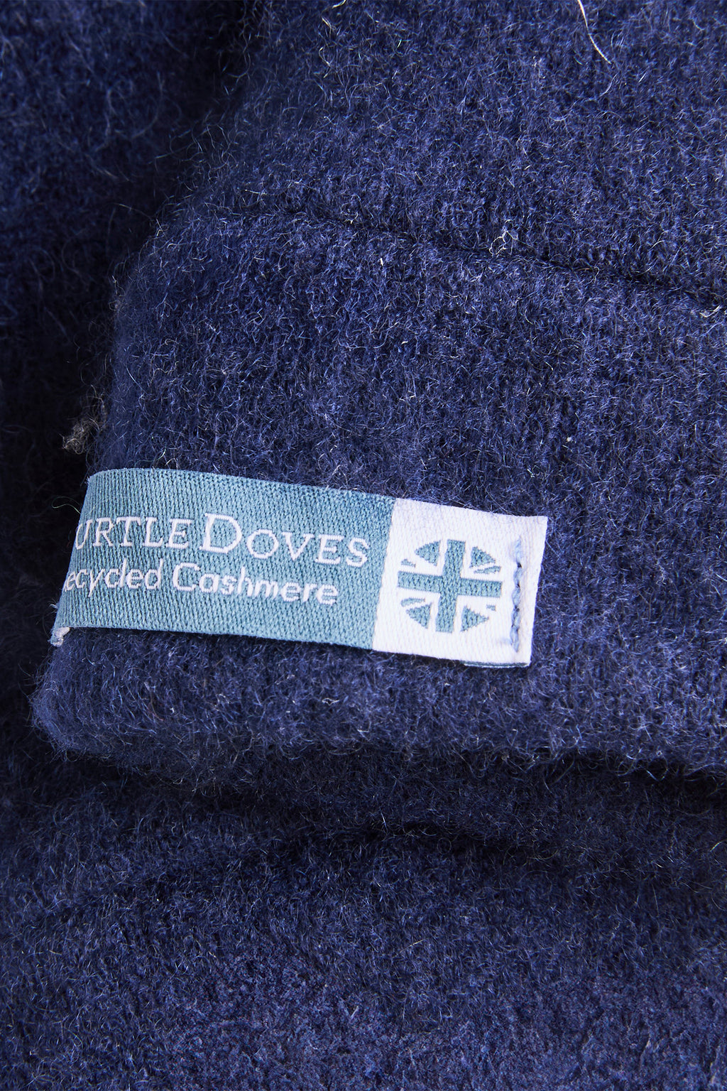 Turtle Doves Navy Cashmere Fingerless Gloves, cuff label close-up