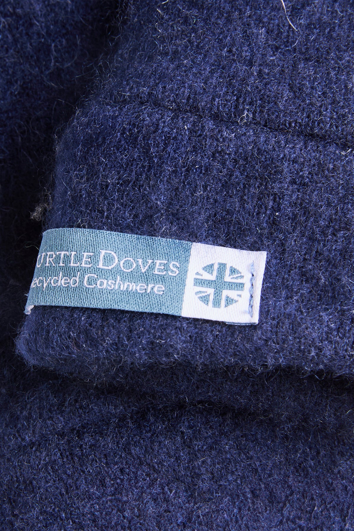 Turtle Doves Navy Cashmere Fingerless Gloves, cuff label close-up