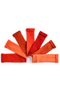 Turtle Doves Orange Cashmere Fingerless Gloves, flat lay