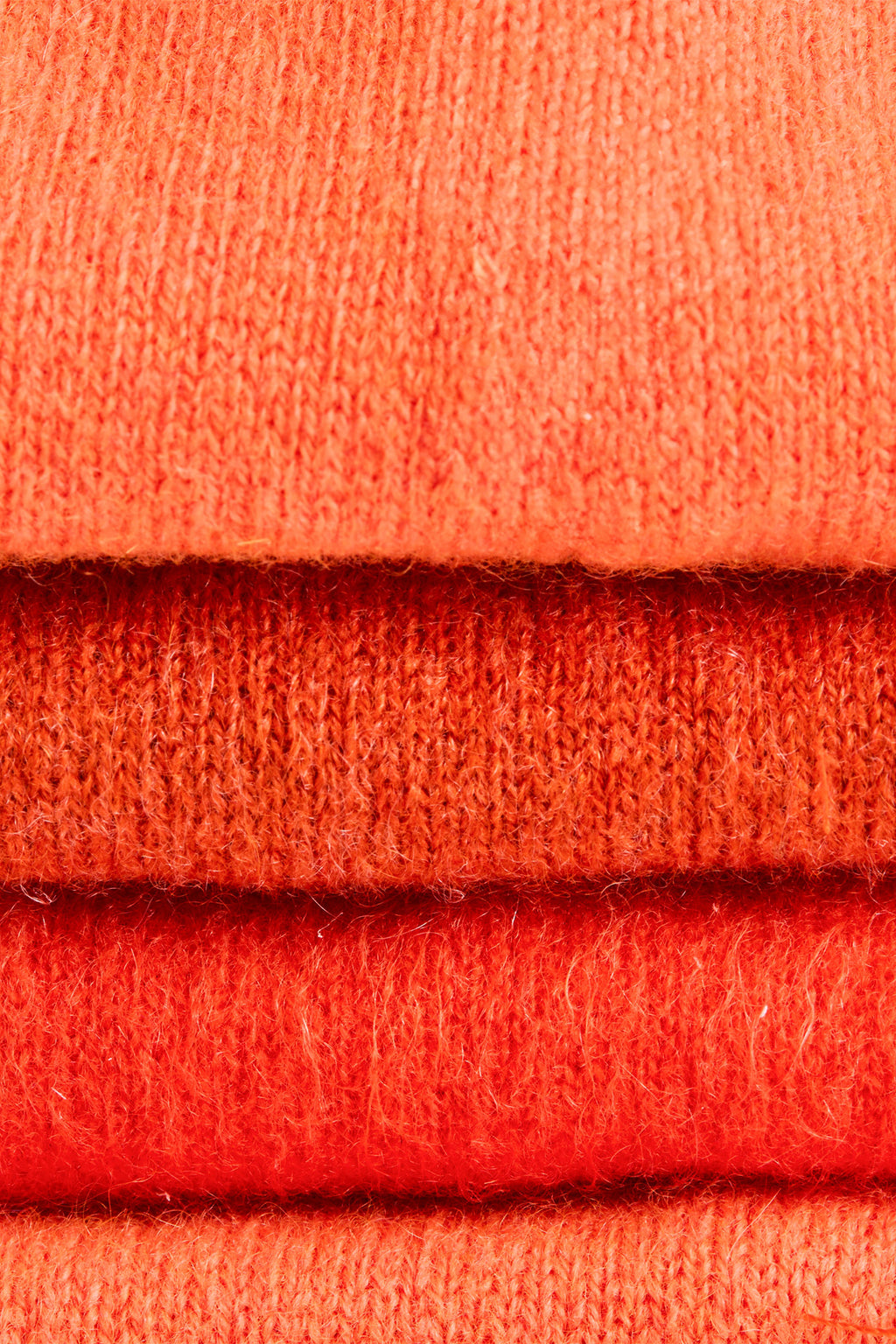 Turtle Doves Orange Cashmere Fingerless Gloves, knit texture close-up