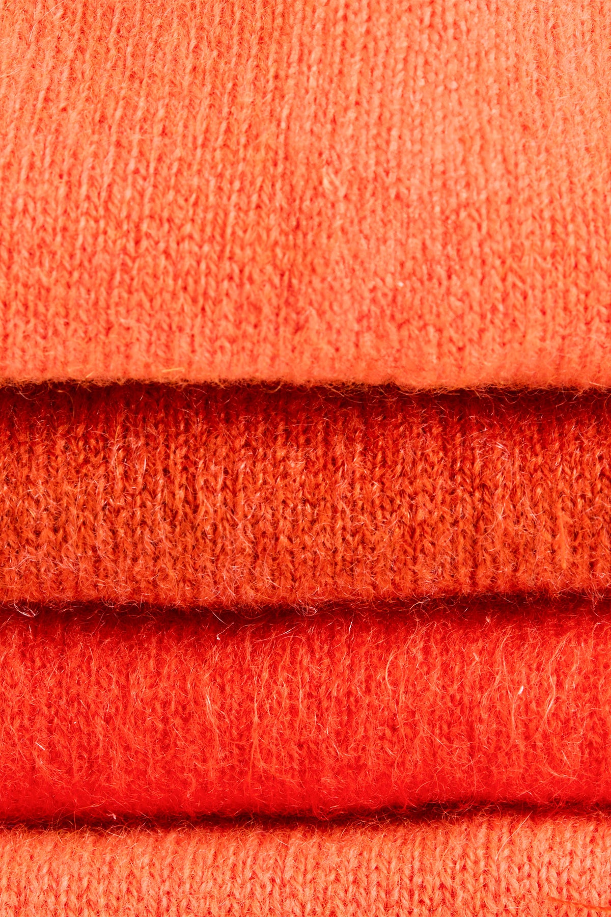 Turtle Doves Orange Cashmere Fingerless Gloves, knit texture close-up
