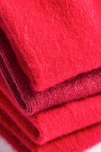 Turtle Doves Red Cashmere Fingerless Gloves, folded stack