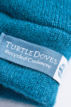 Turtle Doves Teal Blue Cashmere Fingerless Gloves, cuff label close-up