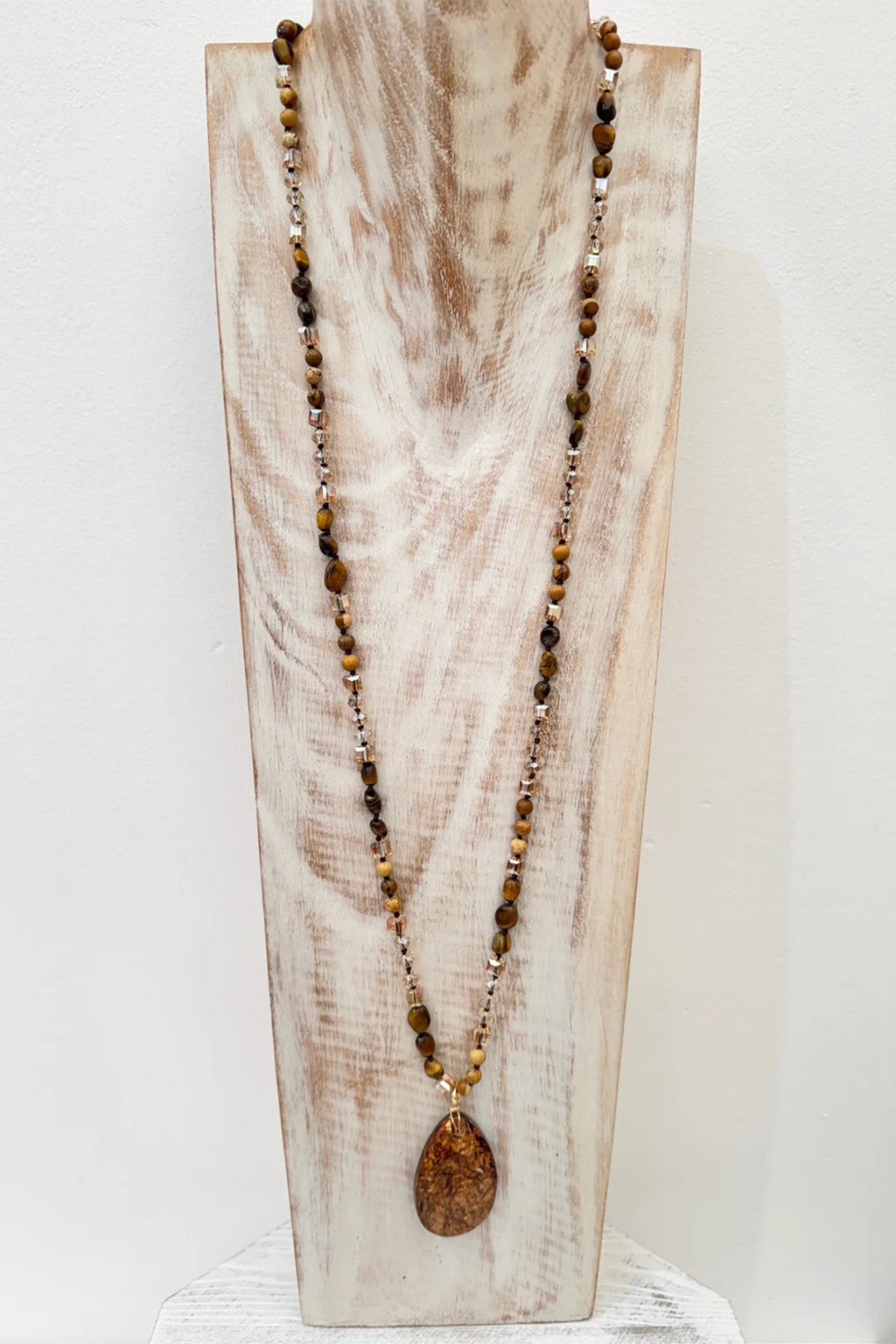 Wild Spirit Desert Dunes Brown Necklace, on display stand, full length view
