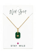 Wild Spirit Malachite Green Star Necklace, flat lay on branded card
