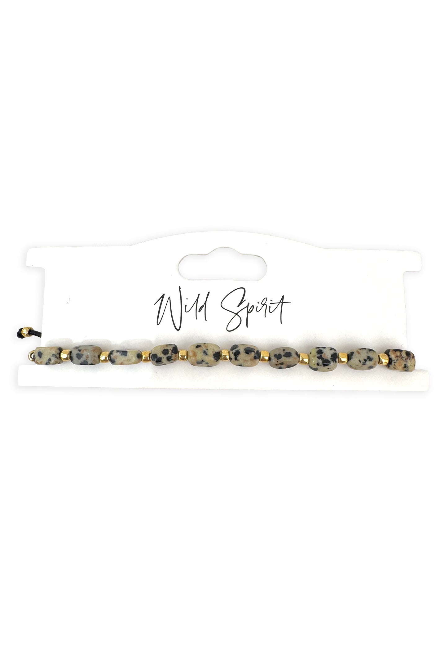 Wild Spirit The Dalmatian Beige Nomad Bracelet, flat lay on branded card