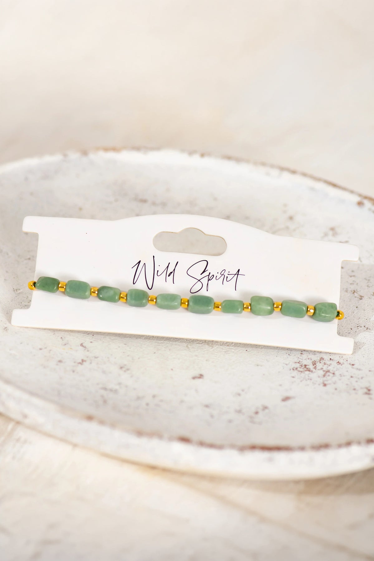 Wild Spirit The Green Jade Nomad Bracelet, flat lay on branded card