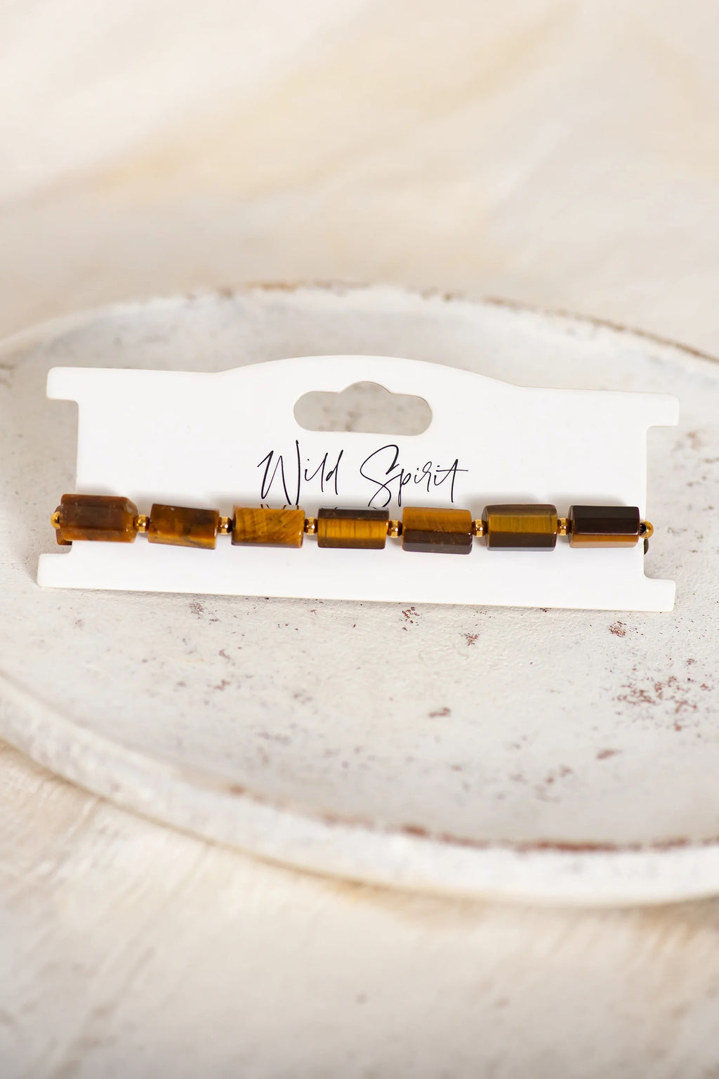 Wild Spirit Tiger Eye Brown Rock Bracelet, flat lay on branded card